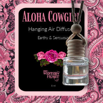 Aloha Cowgirl hanging air diffuser with pink floral design on a pink paisley background