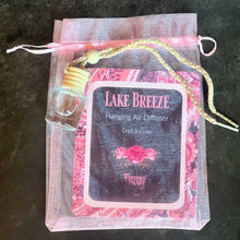 Lake Breeze hanging air diffuser in a decorative bag on a dark surface