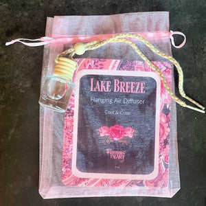 Lake Breeze hanging air diffuser in a decorative bag on a dark surface