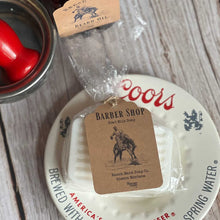 Barber shop soap with a tag on a Coors beer coaster