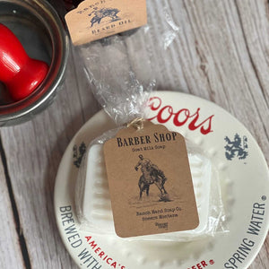 Barber shop soap with a tag on a Coors beer coaster