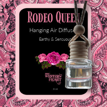 Rodeo Queen hanging air diffuser with pink floral design on a pink paisley background
