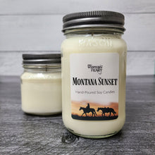 Montana Sunset Candle has cowgirl with horses and sunset