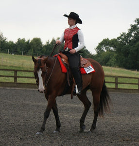 woman riding western show horse show day candle