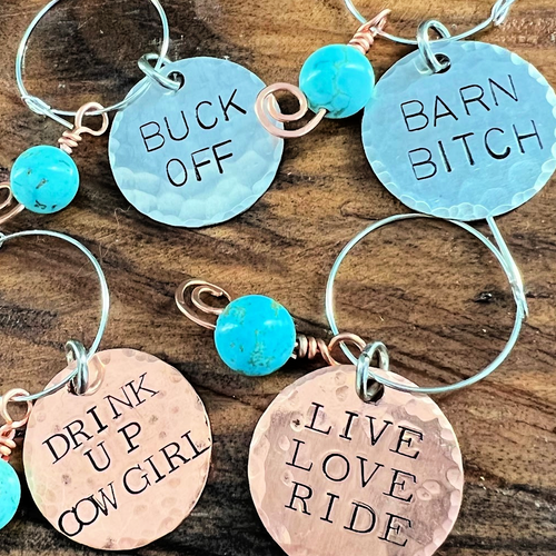 wine charms that say barn bitch, live love ride, buck off, drink up cowgirl